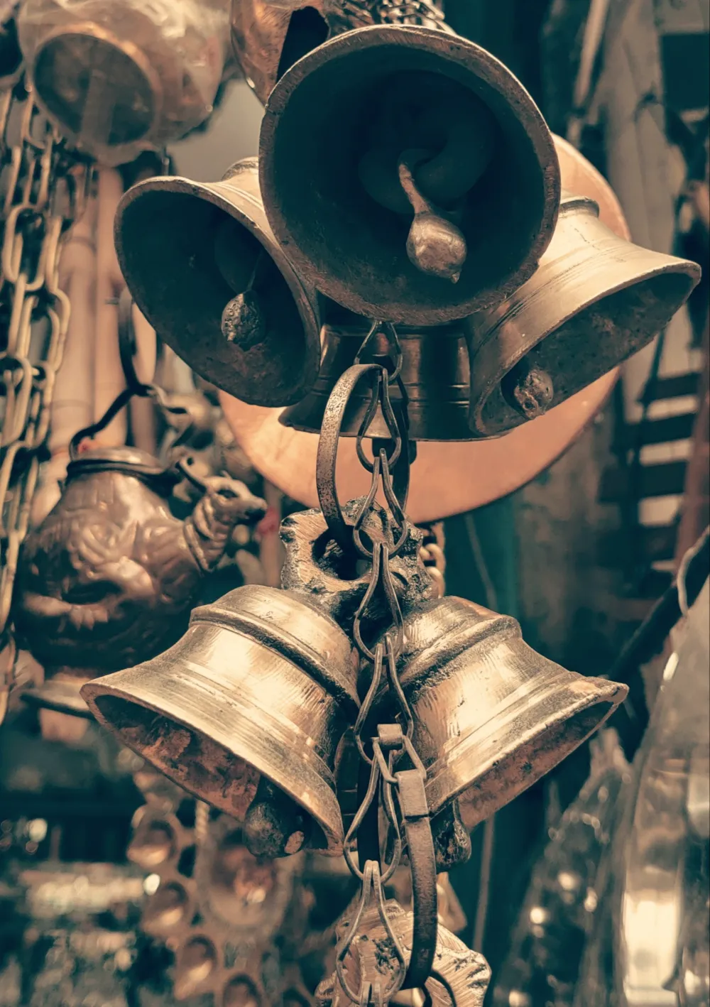 Brass bells hanging together, ready for puja